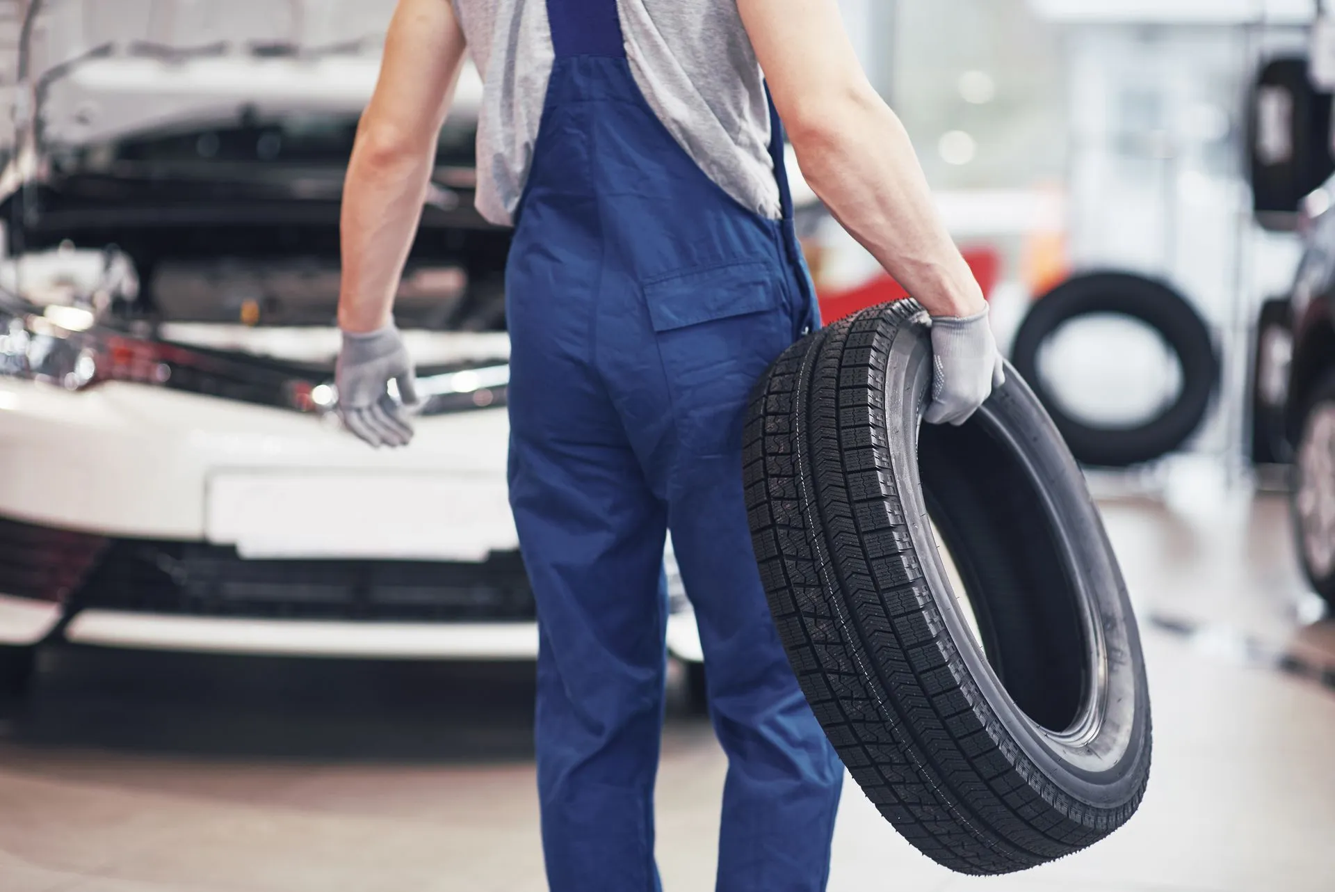 Victory Tire & Auto technician with a tire
